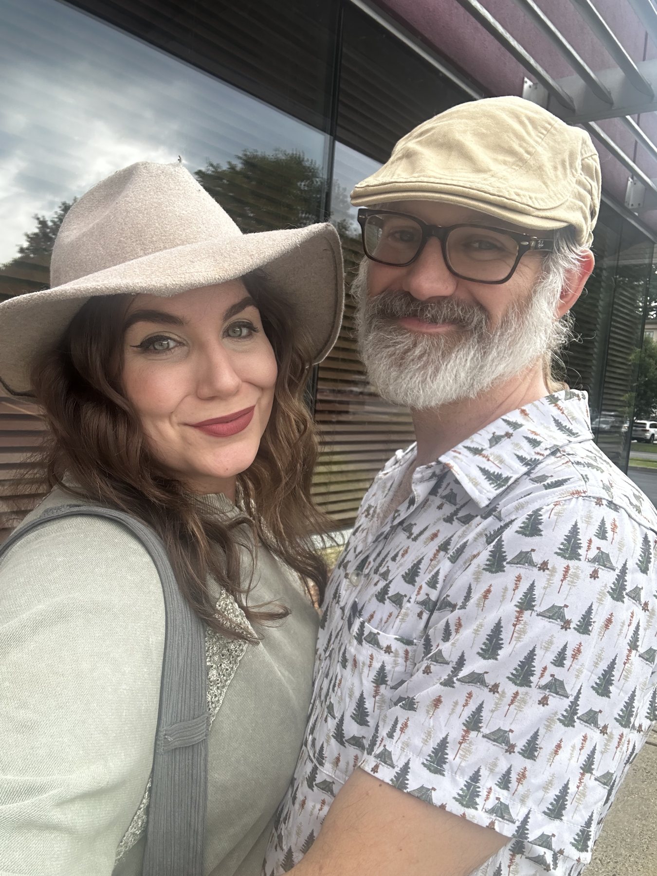 Steve and Nichole smiling together in hats